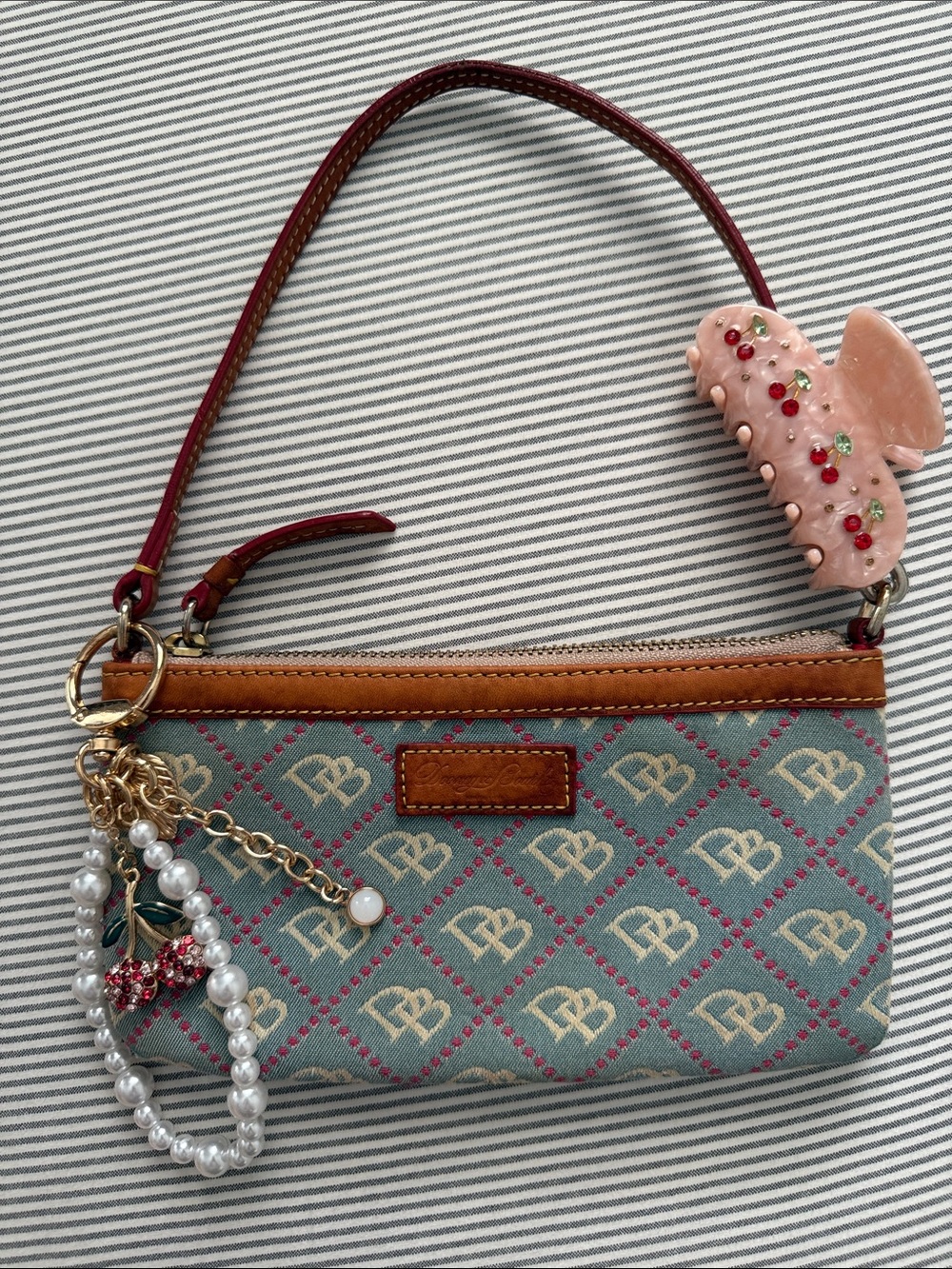 Dooney & Bourke Blue Logo Jacquard Wristlet with Tan Leather Trim